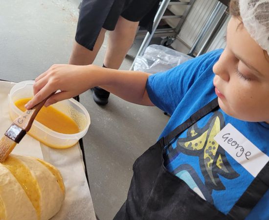 Child making bread